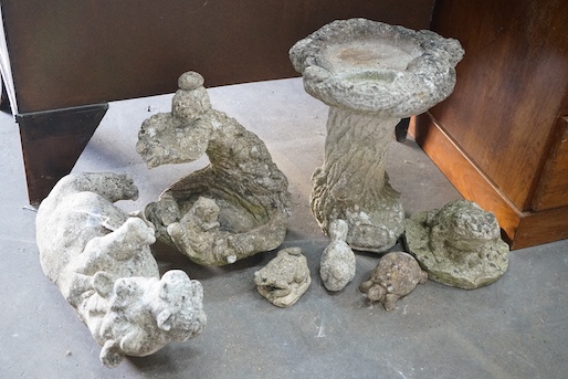 Two reconstituted stone garden bird baths, one moulded with squirrel and five stone garden animal ornaments, largest height 43cm